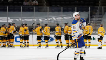 Mar 27, 2021; Boston, Massachusetts, USA; Buffalo Sabres defenseman Rasmus Ristolainen (55) skates towards the locker room as the Boston Bruins congratulate each other after their 3-2 win at TD Garden. Mandatory Credit: Winslow Townson-USA TODAY Sports