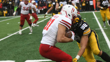 IOWA CITY, IA - NOVEMBER 23: Iowa Hawkeyes left end Anthony Nelson (98) tackles Nebraska Cornhuskers wide receiver Kade Warner (81) after a pass reception during a Big Ten Conference football game between the Nebraska Cornhuskers and the Iowa Hawkeyes on November 23, 2018, at Kinnick Stadium, Iowa City, IA. (Photo by Keith Gillett/Icon Sportswire via Getty Images)