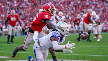 Oct 16, 2021; Athens, Georgia, USA; Kentucky Wildcats wide receiver Wan'Dale Robinson (1) tries to make a catch against Georgia Bulldogs defensive back Lewis Cine (16) during the second half at Sanford Stadium. Mandatory Credit: Dale Zanine-USA TODAY Sports