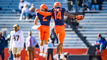 Oct 31, 2020; Champaign, Illinois, USA; Illinois Fighting Illini punter Blake Hayes (14) celebrates his touchdown with running back Chase Brown (2) during the second half at Memorial Stadium. Mandatory Credit: Patrick Gorski-USA TODAY Sports