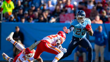 NASHVILLE, TN - NOVEMBER 10: Derrick Henry #22 of the Tennessee Titans delivers a stiff arm during a touchdown carry during the third quarter against the Kansas City Chiefs at Nissan Stadium on November 10, 2019 in Nashville, Tennessee. Tennessee defeats Kansas City 35-32. (Photo by Brett Carlsen/Getty Images)