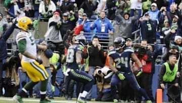 Jan 18, 2015; Seattle, WA, USA; Seattle Seahawks running back Marshawn Lynch (24) scores a go ahead touchdown during the fourth quarter against the Green Bay Packers in the NFC Championship Game at CenturyLink Field. Mandatory Credit: Steven Bisig-USA TODAY Sports