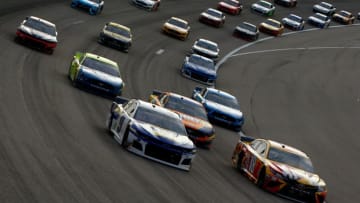 KANSAS CITY, KS - MAY 11: Kyle Busch, driver of the #18 M and M's Red Nose Day Toyota, leads a pack of cars during the Monster Energy NASCAR Cup Series Digital Ally 400 at Kansas Speedway on May 11, 2019 in Kansas City, Kansas. (Photo by Jonathan Ferrey/Getty Images)