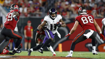 TAMPA, FLORIDA - OCTOBER 27: Devin Duvernay #13 of the Baltimore Ravens carries the ball against the Tampa Bay Buccaneers during the second quarter at Raymond James Stadium on October 27, 2022 in Tampa, Florida. (Photo by Douglas P. DeFelice/Getty Images)