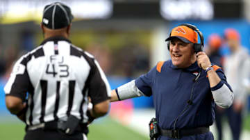 INGLEWOOD, CALIFORNIA - JANUARY 02: Head coach Vic Fangio of the Denver Broncos speaks with an official in the third quarter of the game the Los Angeles Chargers at SoFi Stadium on January 02, 2022 in Inglewood, California. (Photo by Harry How/Getty Images)