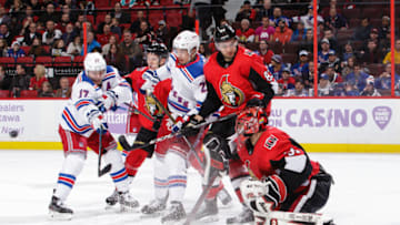 OTTAWA, ON - NOVEMBER 22: Anders Nilsson #31 of the Ottawa Senators makes a save as team mates Christian Jaros #83 and Brady Tkachuk #7 defend against Jesper Fast #17 and Brett Howden #21 of the New York Rangers at Canadian Tire Centre on November 22, 2019 in Ottawa, Ontario, Canada. (Photo by Jana Chytilova/Freestyle Photography/Getty Images)