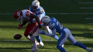 SAN DIEGO, CA - NOVEMBER 29: Steve Gregory #28 and Quentin Jammer #23 of the San Diego Chargers forces a fumble by Runningback Jamaal Charles #25 of the Kansas City Chiefs during the NFL game on November 29, 2009 at Qualcomm Stadium in San Diego, California. (Photo by Donald Miralle/Getty Images)