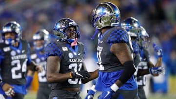 LEXINGTON, KY - OCTOBER 26: Jamar Watson #31 and Calvin Taylor Jr. #91 of the Kentucky Wildcats celebrate after a defensive stop against the Missouri Tigers in the second quarter at Kroger Field on October 26, 2019 in Lexington, Kentucky. (Photo by Joe Robbins/Getty Images)