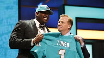 Apr 28, 2016; Chicago, IL, USA; Laremy Tunsil (Mississippi) with NFL commissioner Roger Goodell after being selected by the Miami Dolphins as the number thirteen overall pick in the first round of the 2016 NFL Draft at Auditorium Theatre. Mandatory Credit: Kamil Krzaczynski-USA TODAY Sports
