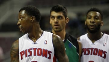 Oct 8, 2013; Auburn Hills, MI, USA; Detroit Pistons guard Kentavious Caldwell-Pope (5) looks to his right with Haifa center Alex Chubrevich (7) and Pistons center Andre Drummond (0) in the background during the second quarter at The Palace of Auburn Hills. Mandatory Credit: Raj Mehta-USA TODAY Sports