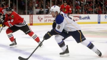 Apr 23, 2014; Chicago, IL, USA; St. Louis Blues left wing Jaden Schwartz (9) skates for the puck as Chicago Blackhawks defenseman Nick Leddy (8) defends during the first period in game four of the first round of the 2014 Stanley Cup Playoffs at United Center. Mandatory Credit: Jerry Lai-USA TODAY Sports
