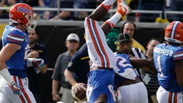 Jan 1, 2016; Orlando, FL, USA; Florida Gators linebacker Jarrad Davis (40) is upended against the Michigan Wolverines during the first quarter in the 2016 Citrus Bowl at Orlando Citrus Bowl Stadium. Mandatory Credit: Reinhold Matay-USA TODAY Sports