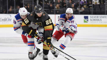 LAS VEGAS, NV - JANUARY 08: Nick Holden #22 of the Vegas Golden Knights battles Brady Skjei #76 of the New York Rangers for the puck during the second period at T-Mobile Arena on January 8, 2019 in Las Vegas, Nevada. (Photo by Jeff Bottari/NHLI via Getty Images)