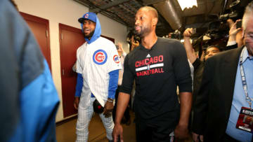 CHICAGO, IL - DECEMBER 2: LeBron James #23 of the Cleveland Cavaliers arrives to the arena wearning a Chicago Cubs uniform and talks with Dwyane Wade #3 of the Chicago Bulls before the game on December 2, 2016 at the United Center in Chicago, Illinois. NOTE TO USER: User expressly acknowledges and agrees that, by downloading and or using this Photograph, user is consenting to the terms and conditions of the Getty Images License Agreement. Mandatory Copyright Notice: Copyright 2016 NBAE (Photo by David Sherman/NBAE via Getty Images)