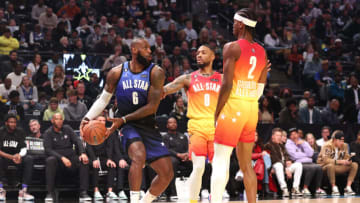 LeBron James #6 of the Los Angeles Lakers is pressured by Damian Lillard #0 of the Portland Trailblazers and Shai Gilgeous-Alexander #2 of the Oklahoma City Thunder (Photo by Tim Nwachukwu/Getty Images)