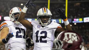 Auburn footballNov 7, 2015; College Station, TX, USA; Auburn Tigers wide receiver Jonathan Wallace (12) celebrates after wide receiver Marcus Davis (not pictured) scores a touchdown against the Texas A&M Aggies during the first quarter at Kyle Field. Mandatory Credit: Troy Taormina-USA TODAY Sports