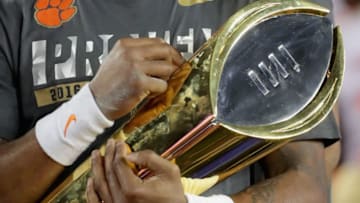 TAMPA, FL - JANUARY 09: Deshaun Watson #4 of the Clemson Tigers celebrates with the trophy after defeating the Alabama Crimson Tide to win the 2017 College Football Playoff National Championship Game 35-31 at Raymond James Stadium on January 9, 2017 in Tampa, Florida. (Photo by Streeter Lecka/Getty Images)