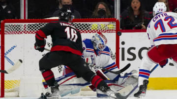 Mar 20, 2022; Raleigh, North Carolina, USA; New York Rangers goaltender Alexandar Georgiev (40) stops the breakaway shot by Carolina Hurricanes center Vincent Trocheck (16) during the second period PNC Arena. Mandatory Credit: James Guillory-USA TODAY Sports