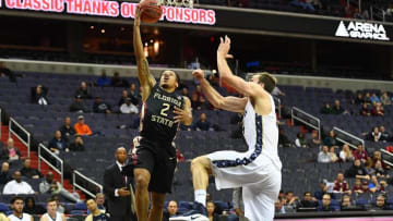 Dec 4, 2016; Washington, DC, USA; Florida State Seminoles guard CJ Walker (2) shoots over George Washington Colonials forward Tyler Cavanaugh (34) during the first half at Verizon Center. Mandatory Credit: Brad Mills-USA TODAY Sports