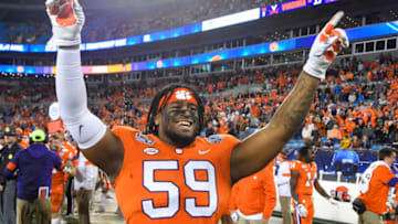 Dec 7, 2019; Charlotte, NC, USA; Clemson Tigers defensive tackle Jordan Williams (59) celebrates after winning the 2019 ACC Championship Game at Bank of America Stadium. Mandatory Credit: Bob Donnan-USA TODAY Sports
