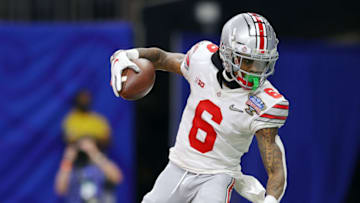 NEW ORLEANS, LOUISIANA - JANUARY 01: Jameson Williams #6 of the Ohio State Buckeyes scores a touchdown against the Clemson Tigers in the fourth quarter during the College Football Playoff semifinal game at the Allstate Sugar Bowl at Mercedes-Benz Superdome on January 01, 2021 in New Orleans, Louisiana. (Photo by Kevin C. Cox/Getty Images)