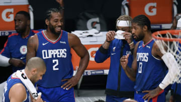 LOS ANGELES, CALIFORNIA - DECEMBER 11: Kawhi Leonard #2 and Paul George #13 of the LA Clippers laugh during a preseason game against the Los Angeles Lakers at Staples Center on December 11, 2020 in Los Angeles, California. (Photo by Harry How/Getty Images)