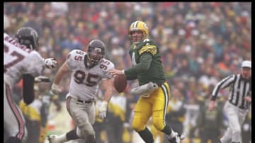 31 Dec 1995: Quarterback Brett Favre of the Green Bay Packers avoid pressure during a game against the Atlanta Falcons at Lambeau Field in Green Bay, Wisconsin. The Packers won the game 37-20. Mandatory Credit: Jed Jacobsohn /Allsport