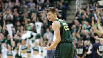 EAST LANSING, MI - JANUARY 4: Matt McQuaid #20 of the Michigan State Spartans celebrates his made basket during the game against the Maryland Terrapins at Breslin Center on January 4, 2018 in East Lansing, Michigan. (Photo by Rey Del Rio/Getty Images)