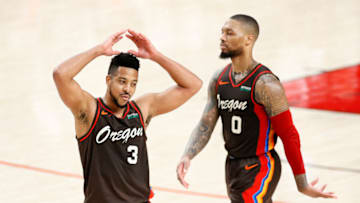 PORTLAND, OREGON - JUNE 03: CJ McCollum #3 and Damian Lillard #0 of the Portland Trail Blazers react in the fourth quarter against the Denver Nuggets during Round 1, Game 6 of the 2021 NBA Playoffs at Moda Center on June 03, 2021 in Portland, Oregon. NOTE TO USER: User expressly acknowledges and agrees that, by downloading and or using this photograph, User is consenting to the terms and conditions of the Getty Images License Agreement. (Photo by Steph Chambers/Getty Images)
