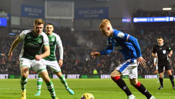 GLASGOW, SCOTLAND - DECEMBER 15: Adam Devine of Rangers runs at Chris Cadden of Hibernian during the Cinch Scottish Premiership match between Rangers FC and Hibernian FC at on December 15, 2022 in Glasgow, Scotland. (Photo by Mark Runnacles/Getty Images)