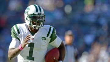 Oct 5, 2014; San Diego, CA, USA; New York Jets quarterback Michael Vick (1) runs the ball during the fourth quarter against the San Diego Chargers at Qualcomm Stadium. Mandatory Credit: Jake Roth-USA TODAY Sports
