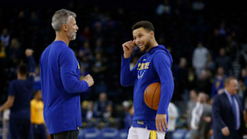 OAKLAND, CA - DECEMBER 27: Stephen Curry #30 of the Golden State Warriors warms up with assistant coach Bruce Fraser before the game against the Utah Jazz at ORACLE Arena on December 27, 2017 in Oakland, California. NOTE TO USER: User expressly acknowledges and agrees that, by downloading and or using this photograph, User is consenting to the terms and conditions of the Getty Images License Agreement. (Photo by Lachlan Cunningham/Getty Images)