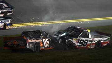 Feb 19, 2016; Daytona Beach, FL, USA; NASCAR Camping World Series driver Rico Abreu (98) crashes with NASCAR Camping World Series driver John Wes Townley (05) during the NextEra Energy Resources 250 at Daytona International Speedway. Mandatory Credit: Mike DiNovo-USA TODAY Sports