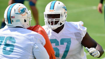 Jun 14, 2016; Miami Gardens, FL, USA; Miami Dolphins offensive lineman Laremy Tunsil (right) blocks Dolphins offensive tackle Branden Albert (left) during practice drills at Baptist Health Training Facility at Nova South. Mandatory Credit: Steve Mitchell-USA TODAY Sports
