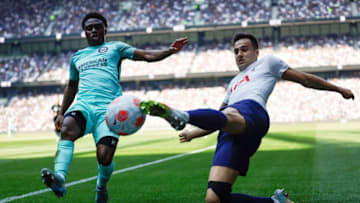 TOPSHOT - Brighton's English midfielder Tariq Lamptey (L) fights for the ball with Tottenham Hotspur's Spanish defender Sergio Reguilon during the English Premier League football match between Tottenham Hotspur and Brighton and Hove Albion at Tottenham Hotspur Stadium in London, on April 16, 2022. - - RESTRICTED TO EDITORIAL USE. No use with unauthorized audio, video, data, fixture lists, club/league logos or 'live' services. Online in-match use limited to 120 images. An additional 40 images may be used in extra time. No video emulation. Social media in-match use limited to 120 images. An additional 40 images may be used in extra time. No use in betting publications, games or single club/league/player publications. (Photo by Tolga Akmen / AFP) / RESTRICTED TO EDITORIAL USE. No use with unauthorized audio, video, data, fixture lists, club/league logos or 'live' services. Online in-match use limited to 120 images. An additional 40 images may be used in extra time. No video emulation. Social media in-match use limited to 120 images. An additional 40 images may be used in extra time. No use in betting publications, games or single club/league/player publications. / RESTRICTED TO EDITORIAL USE. No use with unauthorized audio, video, data, fixture lists, club/league logos or 'live' services. Online in-match use limited to 120 images. An additional 40 images may be used in extra time. No video emulation. Social media in-match use limited to 120 images. An additional 40 images may be used in extra time. No use in betting publications, games or single club/league/player publications. (Photo by TOLGA AKMEN/AFP via Getty Images)