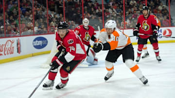 Mar 15, 2015; Ottawa, Ontario, CAN; Ottawa Senators defenseman Mark Borowiecki (74) skates with the puck in front of Philadelphia Flyers center Brayden Schenn (10) in the first period at the Canadian Tire Centre. Mandatory Credit: Marc DesRosiers-USA TODAY Sports