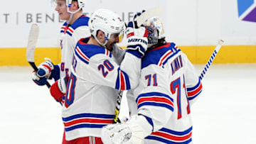 Mar 13, 2021; Boston, Massachusetts, USA; New York Rangers left wing Chris Kreider (20) celebrates with goaltender Keith Kinkaid (71) after defeating the Boston Bruins at the TD Garden. Mandatory Credit: Brian Fluharty-USA TODAY Sports