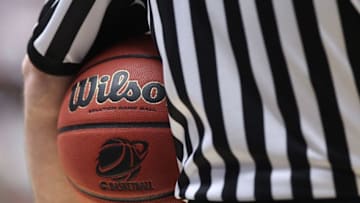TUCSON, AZ - MARCH 17: An official holds a ball during the game between the Temple Owls and the Penn State Nittany Lions in the second round of the 2011 NCAA men's basketball tournament at McKale Center on March 17, 2011 in Tucson, Arizona. (Photo by Christian Petersen/Getty Images)