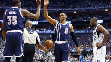 Apr 23, 2016; Dallas, TX, USA; Oklahoma City Thunder forward Kevin Durant (35) and guard Russell Westbrook (0) celebrate in front of Dallas Mavericks guard Raymond Felton (2) during the fourth quarter in game four of the first round of the NBA Playoffs at American Airlines Center. Mandatory Credit: Kevin Jairaj-USA TODAY Sports