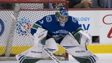 VANCOUVER, BC - FEBRUARY 9: Goalie Michael DiPietro #75 of the Vancouver Canucks readies to make a save during the team warm up prior to NHL action against the Calgary Flames on February, 9, 2019 at Rogers Arena in Vancouver, British Columbia, Canada. (Photo by Rich Lam/Getty Images)