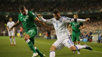 DUBLIN, IRELAND - NOVEMBER 16: Sead Kolasinac of Bosnia and Herzegovina crosses the ball under pressure from Jon Walters of the Republic of Ireland during the UEFA EURO 2016 Qualifier play off, second leg match between Republic of Ireland and Bosnia and Herzegovina at the Aviva Stadium on November 16, 2015 in Dublin, Ireland. (Photo by Ian Walton/Getty Images)