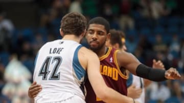 Nov 13, 2013; Minneapolis, MN, USA; Minnesota Timberwolves power forward Kevin Love (42) and Cleveland Cavaliers point guard Kyrie Irving (2) hug before the tip off at Target Center. Mandatory Credit: Brad Rempel-USA TODAY Sports