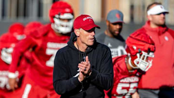 First-year OU football coach Brent Venables works with his team during Thursday's practice in Norman.jenni -- jump
