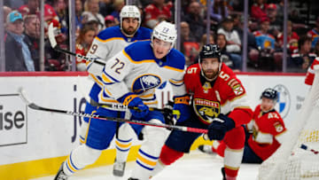 Feb 24, 2023; Sunrise, Florida, USA; Buffalo Sabres center Tage Thompson (72) fights for the puck against Florida Panthers defenseman Aaron Ekblad (5) during the first period at FLA Live Arena. Mandatory Credit: Rich Storry-USA TODAY Sports