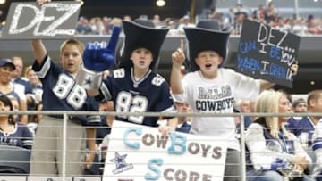 Oct 5, 2014; Arlington, TX, USA; Dallas Cowboys young fans cheer for their team during the game against the Houston Texans at AT&T Stadium. Mandatory Credit: Matthew Emmons-USA TODAY Sports