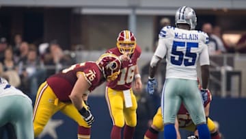 Jan 3, 2016; Arlington, TX, USA; Washington Redskins quarterback Colt McCoy (16) and offensive guard Brandon Scherff (75) and Dallas Cowboys middle linebacker Rolando McClain (55) during the game at AT&T Stadium. The Redskins defeat the Cowboys 34-23. Mandatory Credit: Jerome Miron-USA TODAY Sports
