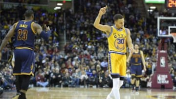 Jan 18, 2016; Cleveland, OH, USA; Golden State Warriors guard Stephen Curry (30) reacts beside Cleveland Cavaliers forward LeBron James (23) in the third quarter at Quicken Loans Arena. Mandatory Credit: David Richard-USA TODAY Sports