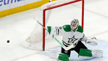 Mar 28, 2023; Chicago, Illinois, USA; Dallas Stars goaltender Jake Oettinger (29) deflects a shot against the Chicago Blackhawks during the first period at United Center. Mandatory Credit: David Banks-USA TODAY Sports
