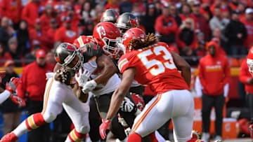 Nov 20, 2016; Kansas City, MO, USA; Tampa Bay Buccaneers running back Doug Martin (22) runs the ball and is tackled by Kansas City Chiefs outside linebacker Justin Houston (50) during the first half at Arrowhead Stadium. Mandatory Credit: Denny Medley-USA TODAY Sports