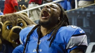 Sep 29, 2013; Detroit, MI, USA; Detroit Lions free safety Louis Delmas (26) celebrates after the game against the Chicago Bears at Ford Field. The Lions won 40-32. Mandatory Credit: Rick Osentoski-USA TODAY Sports